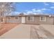 Charming one-story house featuring a well-kept front yard, a long driveway, and a classic design at 3305 Palomar St, North Las Vegas, NV 89030