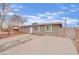 Inviting single-story home with a neat front yard, long driveway, and quaint curb appeal at 3305 Palomar St, North Las Vegas, NV 89030