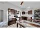 Well-lit kitchen with modern appliances, wooden cabinetry, hard surface floors and dining area, perfect for casual meals at 3305 Palomar St, North Las Vegas, NV 89030