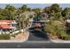 Aerial view of community showcasing lush landscaping, mature trees, and a secured entrance at 3440 Pino Cir, Las Vegas, NV 89121