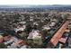 Aerial view of community showing mature trees, swimming pools and tile roofs at 3440 Pino Cir, Las Vegas, NV 89121