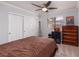 Cozy bedroom with ample closet space, a ceiling fan, and neutral décor, creating a relaxing retreat at 3440 Pino Cir, Las Vegas, NV 89121