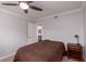 Comfortable bedroom with a ceiling fan, neutral walls, and ensuite bathroom access at 3440 Pino Cir, Las Vegas, NV 89121