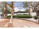 The Sunrise Villas community entrance features manicured landscaping and secure access at 3440 Pino Cir, Las Vegas, NV 89121