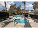 Resort-style community pool with lounge chairs and jacuzzi offers residents a luxurious experience at 3440 Pino Cir, Las Vegas, NV 89121