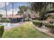 Community pool with lounge chairs, landscaping, and a privacy fence offers outdoor relaxation at 3440 Pino Cir, Las Vegas, NV 89121
