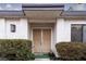 Covered entryway featuring a double door entry, exterior light fixture, and tidy shrubbery at 3440 Pino Cir, Las Vegas, NV 89121