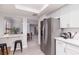 Bright kitchen featuring stainless steel appliances and white cabinets, perfect for cooking and entertaining at 3440 Pino Cir, Las Vegas, NV 89121