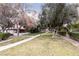 Serene landscaping with mature trees and verdant lawns enhance the community appeal at 3440 Pino Cir, Las Vegas, NV 89121