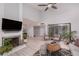 Spacious living room featuring a fireplace, comfortable seating, and access to the backyard at 3440 Pino Cir, Las Vegas, NV 89121