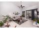 Spacious living room with vaulted ceilings, neutral tones, and a large sliding glass door for natural light at 3440 Pino Cir, Las Vegas, NV 89121