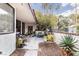 Relaxing patio space with a BBQ grill, comfortable seating, and lush greenery, ideal for outdoor living at 3440 Pino Cir, Las Vegas, NV 89121
