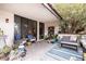 Outdoor patio area with comfortable seating, a grill, and privacy plants, perfect for enjoying the outdoors at 3440 Pino Cir, Las Vegas, NV 89121