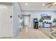 Inviting entryway featuring tile flooring, light blue walls, with an arcade game at 3610 El Camino Rd, Las Vegas, NV 89103