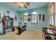 Spacious bedroom with carpet flooring, dual windows with shutters, and comfortable seating at 3801 W Hammer Ln, North Las Vegas, NV 89031