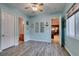 Light blue bedroom featuring wood-look floors and multiple doorways at 3801 W Hammer Ln, North Las Vegas, NV 89031