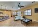 Cozy living room with natural light and seamless transition to the kitchen and dining area at 3801 W Hammer Ln, North Las Vegas, NV 89031