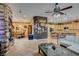 Open concept living space featuring a fireplace, seamless flow to dining and kitchen areas at 3801 W Hammer Ln, North Las Vegas, NV 89031