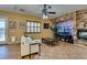 Comfortable living room with a stone fireplace, neutral decor, and ample seating at 3801 W Hammer Ln, North Las Vegas, NV 89031