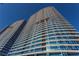 Stunning high-rise building featuring modern architecture with reflective glass windows against a vibrant blue sky at 4575 Dean Martin Dr # 3007, Las Vegas, NV 89103