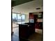 Bright kitchen with dark cabinets, an island with bar seating, and great city views at 4575 Dean Martin Dr # 3007, Las Vegas, NV 89103