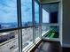 Living room with hardwood floors, balcony access, and expansive city views at 4575 Dean Martin Dr # 3007, Las Vegas, NV 89103