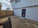 Fenced backyard featuring a black door entry on the main house with space to personalize at 4754 Marnell Dr, Las Vegas, NV 89121