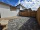 Private backyard featuring gray pavers and a new wooden fence offers an inviting outdoor living space at 4754 Marnell Dr, Las Vegas, NV 89121