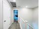 Upstairs hallway featuring neutral walls, gray carpet and white trim; leading to bedroom at 483 Fairview Hills St, Las Vegas, NV 89138