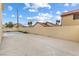 Spacious backyard, featuring a large concrete patio, and privacy walls at 5516 Cory Pl, Las Vegas, NV 89107