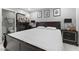 Well-lit bedroom features a dark wood bed frame and matching dressers and a glimpse of the en-suite bathroom at 5516 Cory Pl, Las Vegas, NV 89107