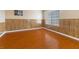Bedroom with wood-look floors and a window providing natural light at 5516 Cory Pl, Las Vegas, NV 89107