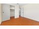 Bedroom features hardwood floors and a doorway to the closet with closet organizer at 5516 Cory Pl, Las Vegas, NV 89107