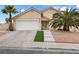 Charming two-story home featuring a two car garage, and well-kept landscaping at 5516 Cory Pl, Las Vegas, NV 89107