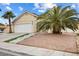 Beautiful single-Gathering home featuring a two car garage, desert landscaping, and palm trees at 5516 Cory Pl, Las Vegas, NV 89107