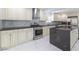 Well-appointed kitchen with stainless steel appliances, marble countertops, and ample storage space for organization at 5516 Cory Pl, Las Vegas, NV 89107