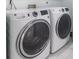 Close-up of front-loading washer and dryer in the laundry room at 5516 Cory Pl, Las Vegas, NV 89107