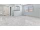 Bright living area featuring marble floors and natural light, complete with an open layout and stylish finishes at 5516 Cory Pl, Las Vegas, NV 89107