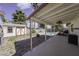 Wide backyard view of covered patio, BBQ, shed, and in-ground pool at 6244 Eugene Ave, Las Vegas, NV 89108