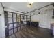 Garage conversion to living area with kitchen area, industrial garage door, and modern pendant lighting at 6244 Eugene Ave, Las Vegas, NV 89108