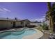 Backyard pool with adjacent spa, patio area, and lush landscaping, perfect for outdoor relaxation at 6244 Eugene Ave, Las Vegas, NV 89108