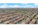An aerial view reveals a well-planned community with neatly lined streets and uniformly designed homes at 6435 Parrot Ridge Ct, Las Vegas, NV 89139