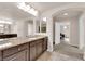 Bathroom showcasing a vanity with granite counters and access to the bedroom at 6435 Parrot Ridge Ct, Las Vegas, NV 89139