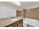 Bathroom with a combination shower and tub, and a neutral vanity at 6435 Parrot Ridge Ct, Las Vegas, NV 89139