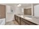 Bathroom with a double sink vanity and combination shower and tub at 6435 Parrot Ridge Ct, Las Vegas, NV 89139