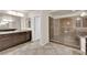 Bathroom featuring a large glass enclosed shower and dual sink vanity at 6435 Parrot Ridge Ct, Las Vegas, NV 89139