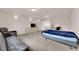 Generous bedroom featuring a bed, comfortable seating, and a functional work area at 6435 Parrot Ridge Ct, Las Vegas, NV 89139