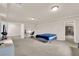 Large bedroom with a bed, desk, and ample space for furniture arrangement at 6435 Parrot Ridge Ct, Las Vegas, NV 89139
