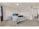 Cozy bedroom with plush carpeting and a comfortable queen size bed at 6435 Parrot Ridge Ct, Las Vegas, NV 89139