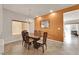 Dining room with an eye-catching accent wall and elegant lighting fixture at 6435 Parrot Ridge Ct, Las Vegas, NV 89139